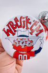 Button badge with 'Wreck 'Em' text and Raider red on a white background